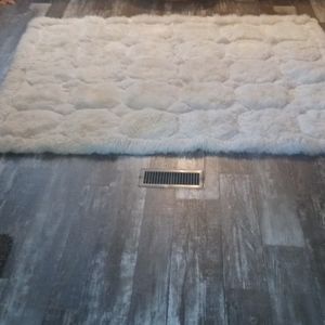 Rug or can be used as a throw for a bed
